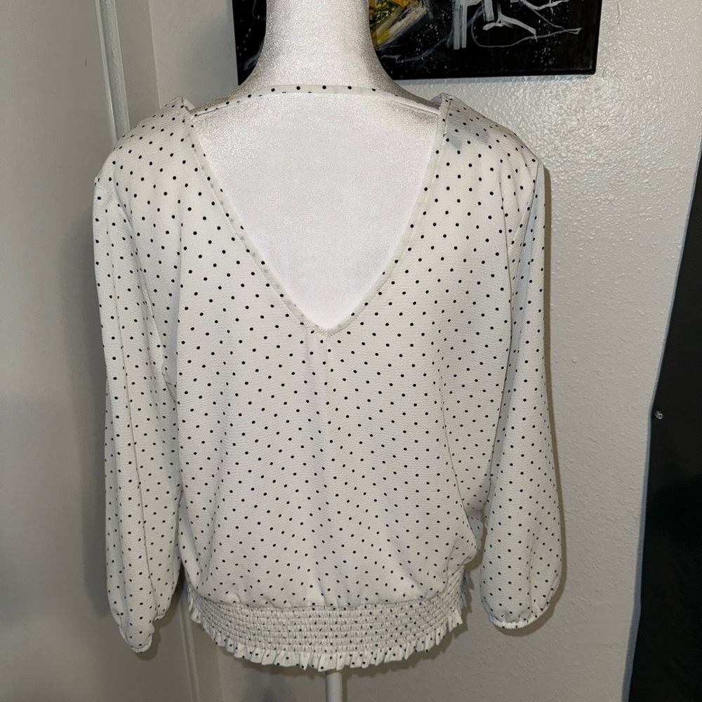 Large polka dot blouse. Business casual attire.